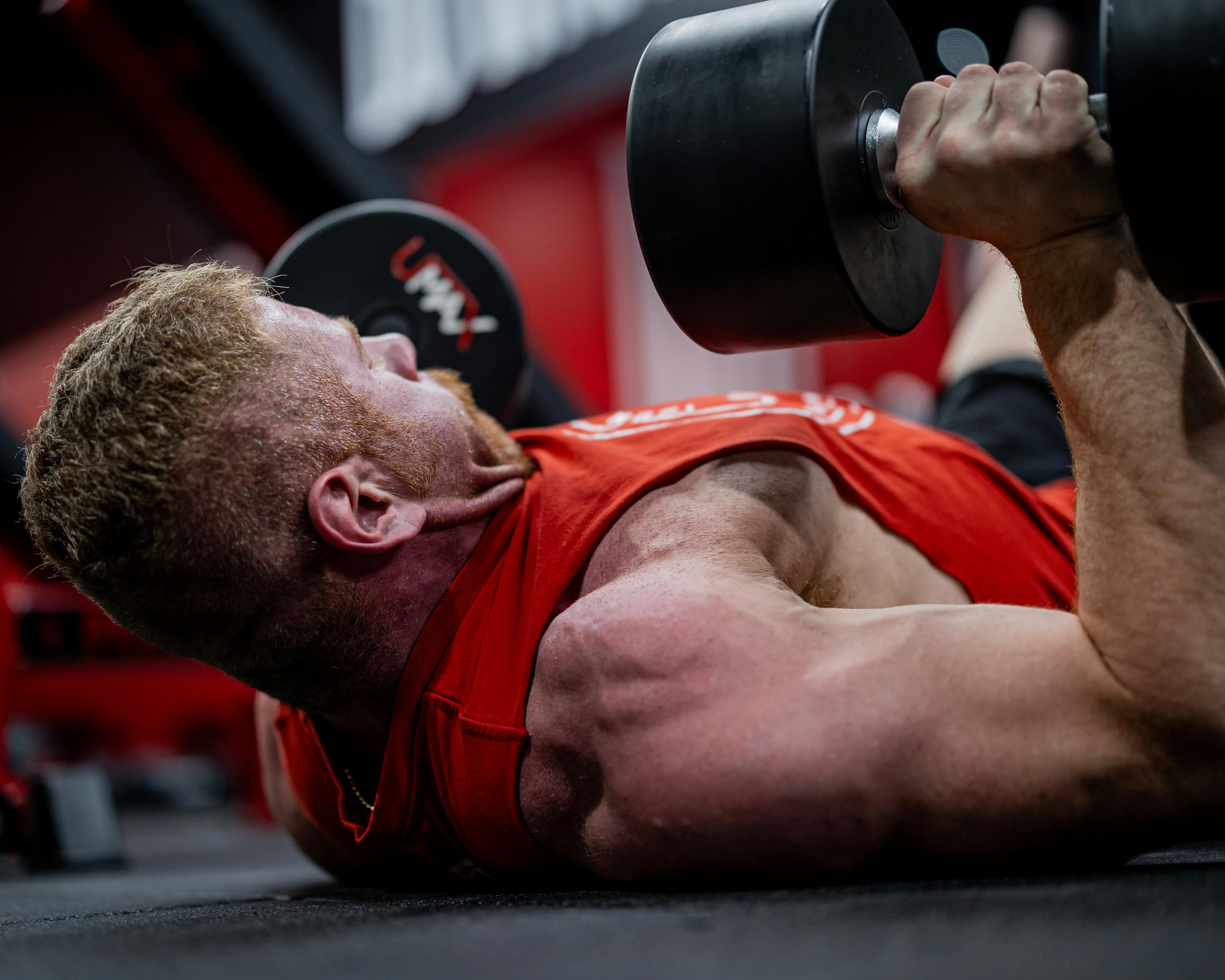 Strength athlete pushing a challenging gym set