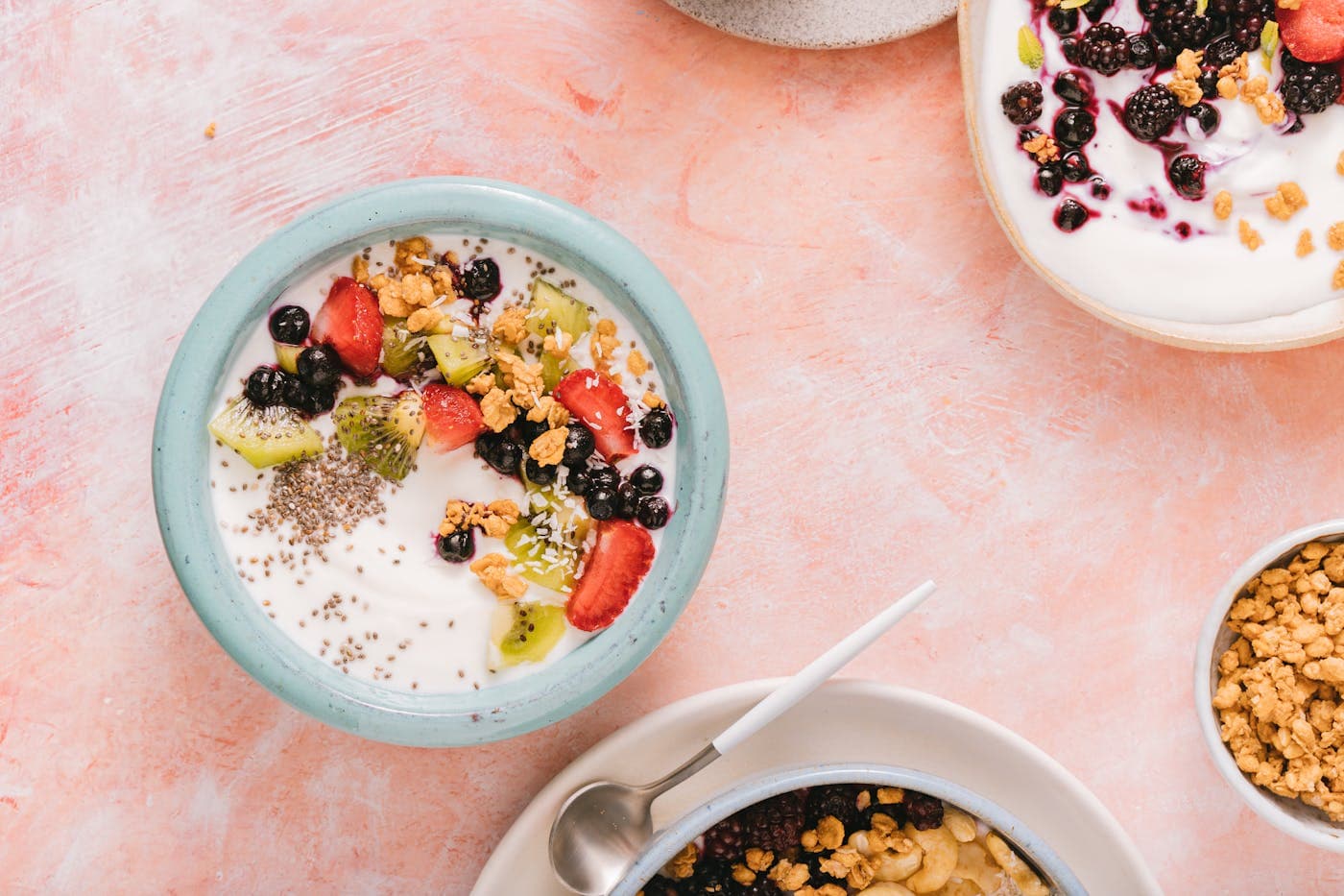 Fruit and yogurt bowl with seeds and granola for broad micronutrient intake