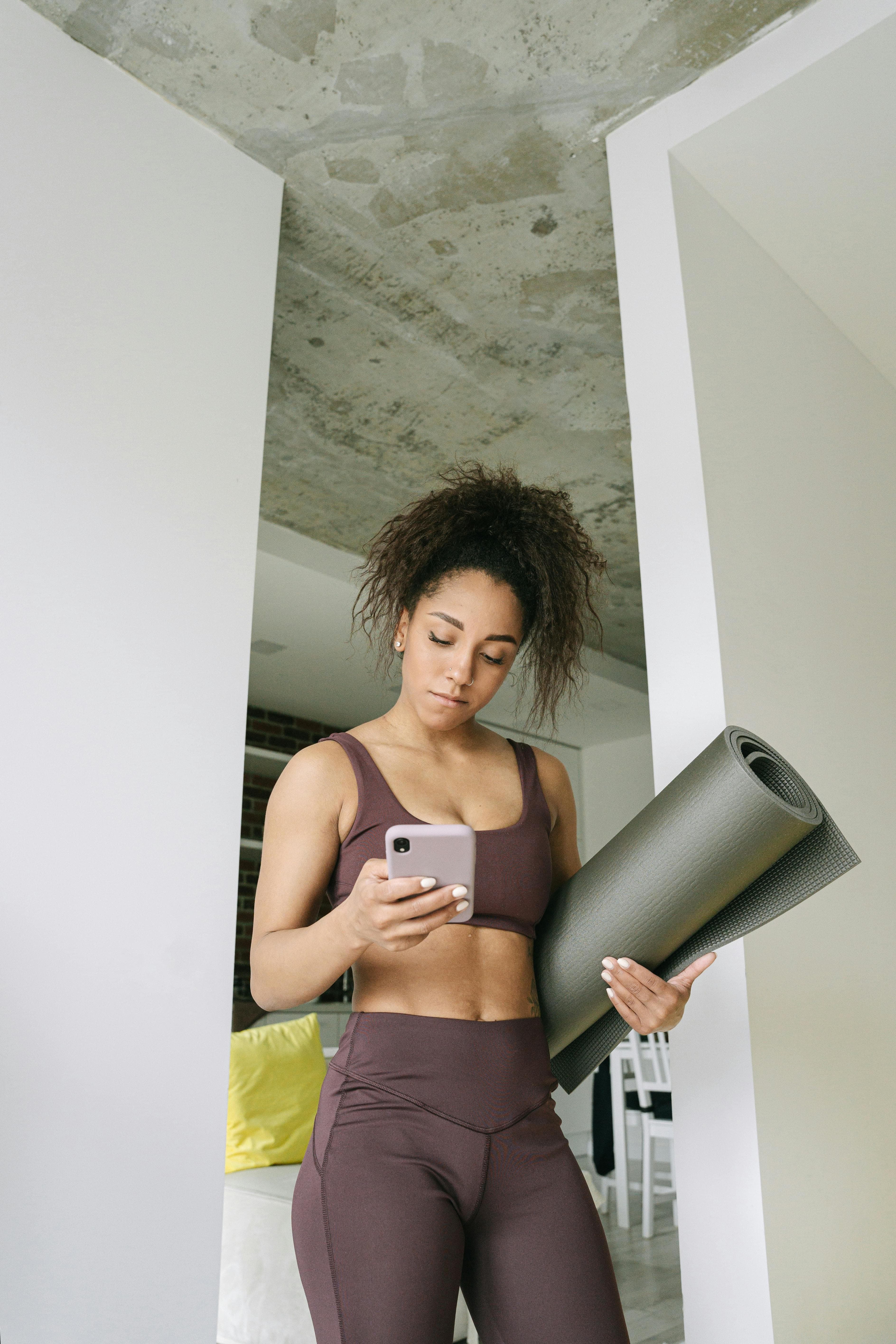 Athlete checking mobile workout data before training