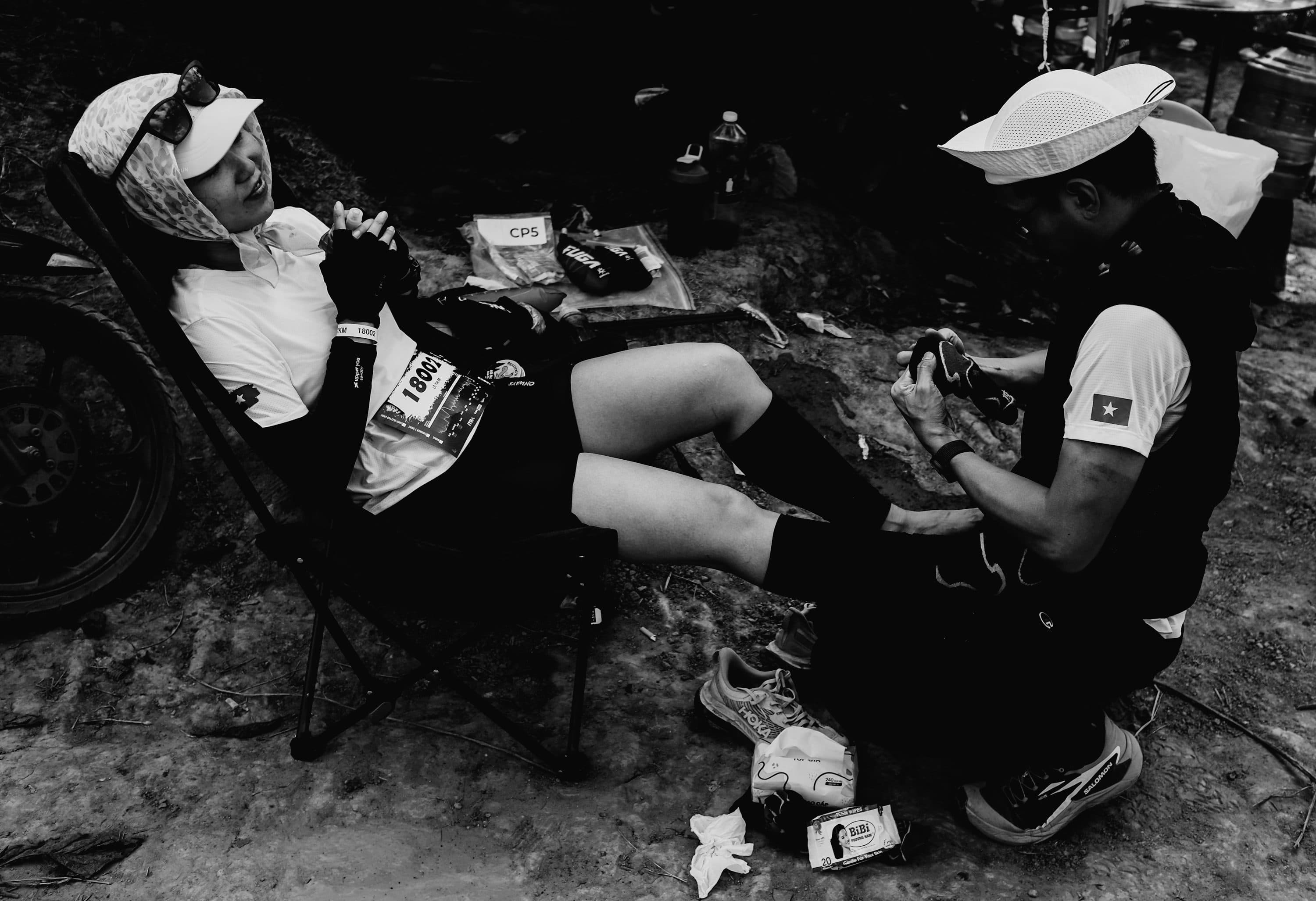 Endurance athlete receiving recovery support during a race